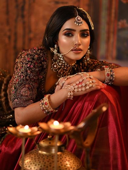 A shot that incorporates the candle-lit setting, adding warmth and drama to the overall image.