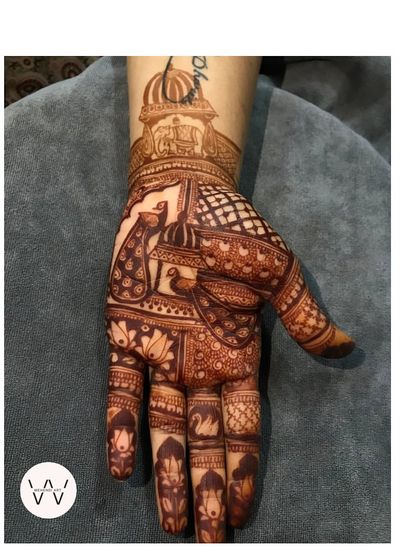 A slightly different version of the royal peacock design, with a name written on the wrist.