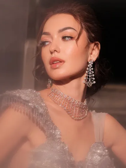 A beautiful portrait capturing the sparkle of the diamond earrings and necklace. The styling is timeless and elegant.