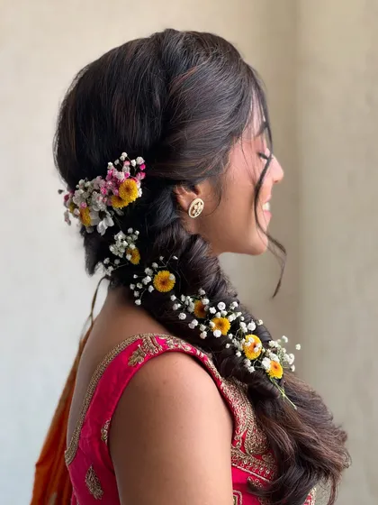Another angle of the beautiful floral braid, a perfect hairstyle for a Haldi or Mehendi event.