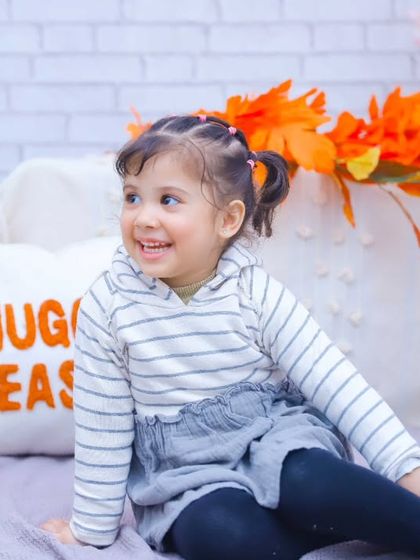 A bright, happy smile from this little girl during her "Snuggle Season" themed shoot.
