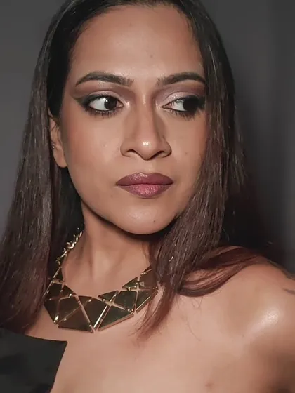 A three-quarter view of the glam makeup. This angle shows the shimmer on the eyelid and the highlight on the cheekbones, which adds dimension and a touch of glamour.