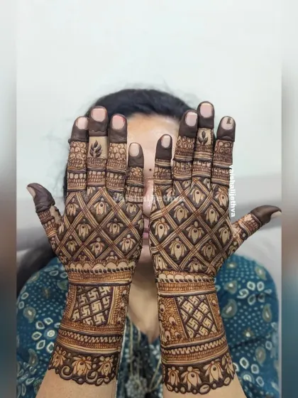 A full-coverage back-hand design with a checkered pattern. The auspicious swastika symbols add a traditional touch to this modern layout.