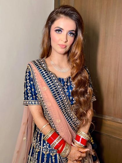 A portrait showing her confidence and the beautiful contrast between the blue eyeshadow and her navy outfit.