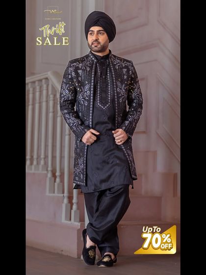 A striking black Indo-Western sherwani with intricate silver embroidery, featured as part of my thrift sale.