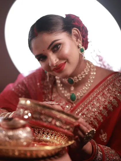 A stunning Karva Chauth look, with the model holding the puja thali.