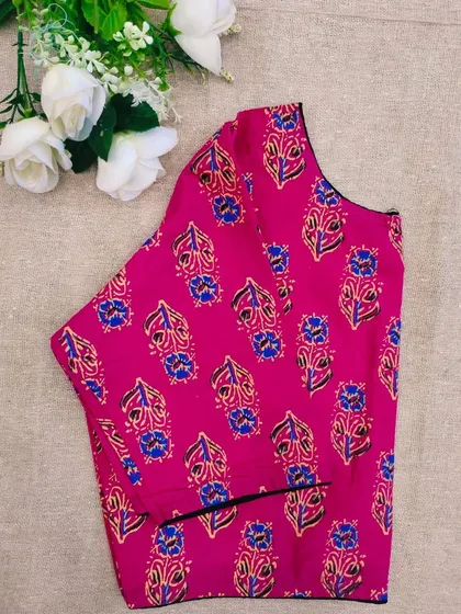 The pink leaf-printed cotton boatneck blouse.