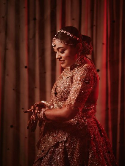 A collection of professional shots of my bride Shachi. Her dusty rose lehenga with a long trail was pure magic. We did a soft glam look with a subtle smokey eye to match the grandeur.