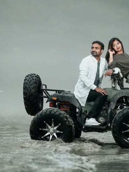 A stylish shot of a couple posing with an ATV in the misty river. This is a great option for a unique and adventurous pre-wedding theme.