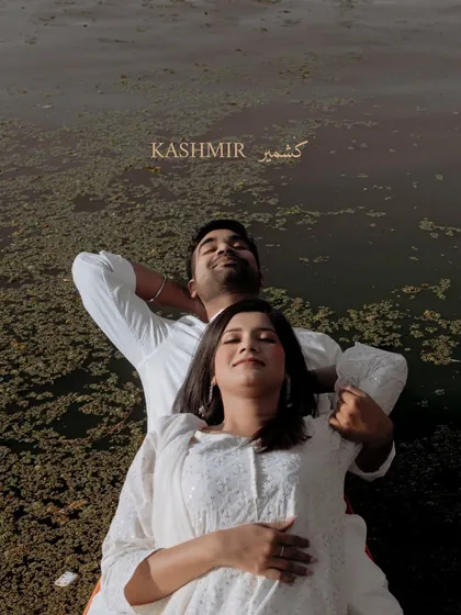 A moment of peace and togetherness. Vidhi and Singh relax by the water in Kashmir, a simple yet profound image that speaks volumes about their comfortable love.