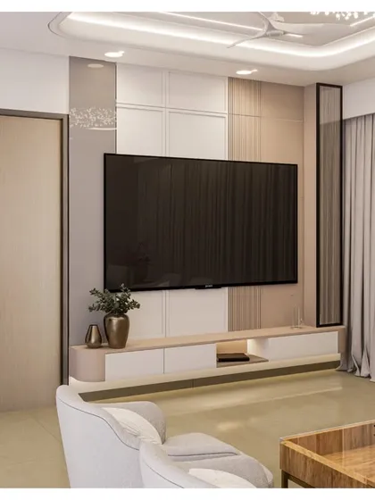 This living room TV unit is designed for a clean, minimalist aesthetic. The simple floating console is mounted on a wall with a subtle mix of textures and a slim black frame detail, keeping the focus on the screen.