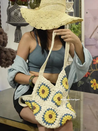 Our sunflower crochet tote bag is perfect for a beach day or a casual outing. It's lightweight, spacious, and the sunflower granny square pattern adds a cheerful, retro vibe.