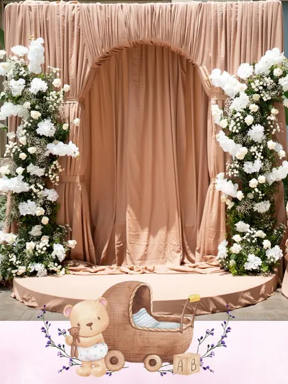 For a classic and intimate baby shower, we used a soft Mocha Mousse color palette to create a world of gentle sophistication. Layers of custom drapes and delicate white florals came together to wrap the celebration in calm, grace, and warmth.