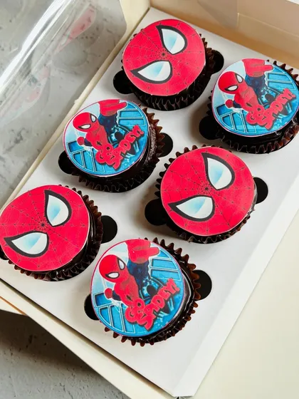 I designed these Spider-Man themed cupcakes for a little hero's birthday party. Each chocolate cupcake is topped with a high-quality, edible print of the iconic superhero, making them a guaranteed hit with the kids.