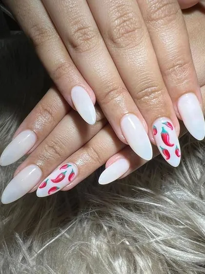 How fun are these? I hand-painted these spicy red chillies on milky white gel extensions for a client who wanted a unique and playful summer look.