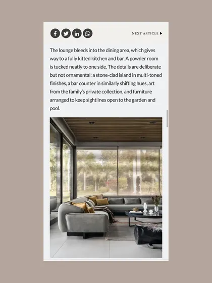 This page from the Architecture+Design feature focuses on the open-plan lounge and dining area, noting how the furniture was arranged to maintain clear sightlines to the garden and pool.