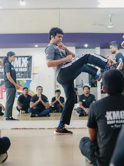 Our training is not just for law enforcement. We conduct practical seminars for civilians and professionals, like this Third Party Protection workshop in Mangalore, where our head instructor demonstrates a defensive front kick.