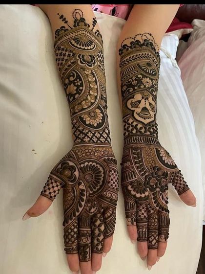 A full-sleeve design with a mix of bold, traditional motifs and delicate filler patterns.