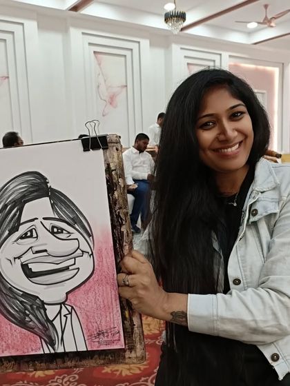 A guest from the Keystone event with a big, happy smile and an equally happy caricature.