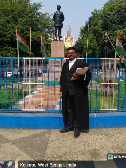 Standing before a statue in Kolkata, ready for a day of legal proceedings. My work requires me to be present and prepared across different cities.