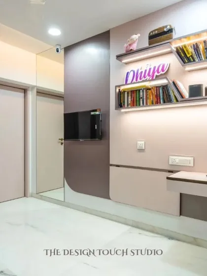This image shows the room in its study and play configuration. The floating shelves with integrated lighting provide a perfect spot for books and decor, while the hidden study table offers a dedicated workspace.