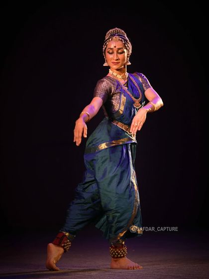 A softer, more lyrical pose. Not all of Kuchipudi is fast-paced; it also has moments of gentle, flowing movement.