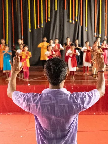 The view from my position as a choreographer. Leading a group of dedicated students is one of the most fulfilling parts of my work. It's about passing on the tradition and shaping a collective energy on stage.