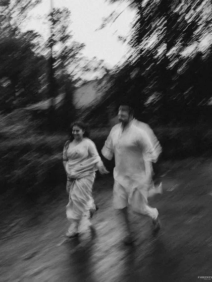 Another artistic motion blur, this time in black and white. It creates a moody, dreamlike image of the couple walking together, focusing on the feeling rather than the details.