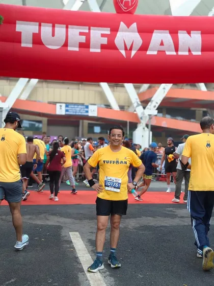 A member standing proudly at the Tuffman race entrance. We are always ready to take on new challenges and push our limits.