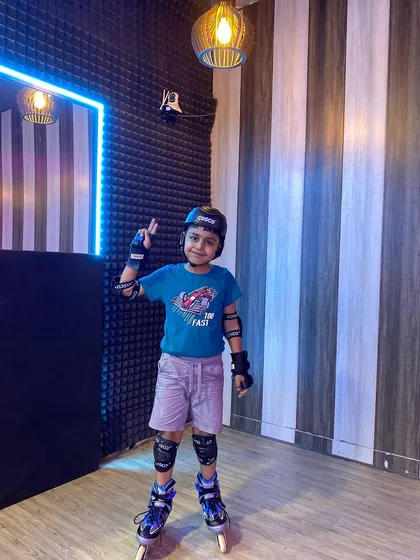 Posing with a peace sign, this student is happy and confident on his skates. We aim to make learning a joyful experience.