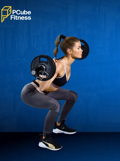 Strength looks good on you. A member performs a barbell back squat, a core exercise for building lower body power and a strong posterior chain.