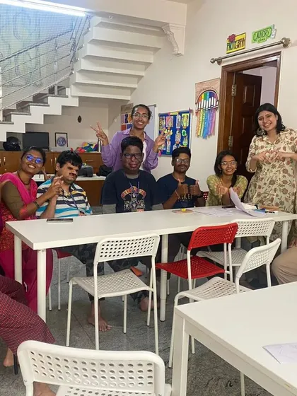 Volunteers and students playing games at one of our partner centers. These simple, joyful interactions are at the core of our weekend volunteering programs.