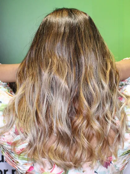 A full view of the wonder blonde hair color, showing the gradient from dark roots to light ends.