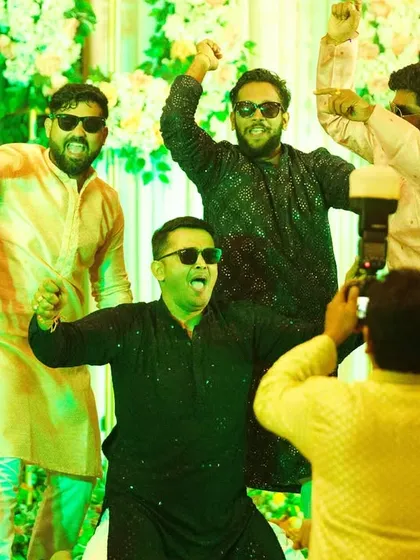 A wedding is also about the 'shaadi chaos' and the incredible energy of friends and family. The Sangeet night is where the groom's squad brings the house down. Capturing this unrestrained fun and brotherhood is just as important as the quiet moments. It’s the story of everyone who came to celebrate your love.