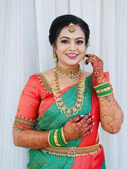This is the essence of my work: a radiant South Indian bride. I focused on creating a flawless, skin-like base that looks natural and feels comfortable, paired with classic eye makeup and a smile that says she feels as beautiful as she looks.
