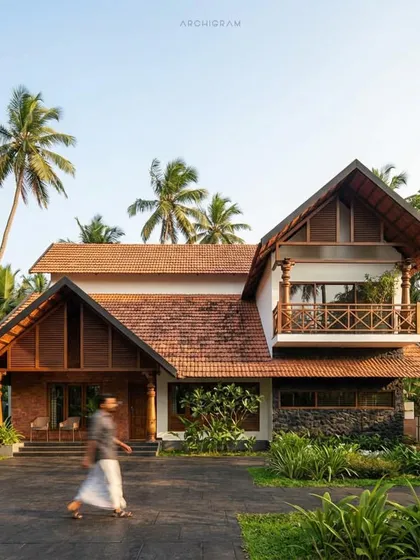 This residential project by Archigram in Malappuram is a beautiful example of traditional Kerala architecture, with its intricate woodwork, tiled roofs, and welcoming porch.