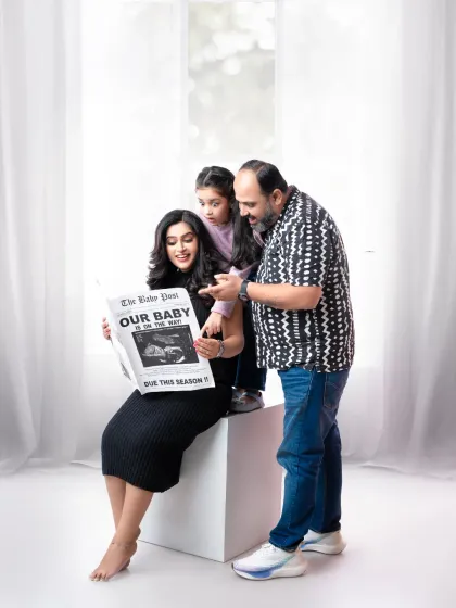 A creative pregnancy announcement featuring the whole family. Using a custom newspaper prop, we shared the exciting news in a unique and personal way, making sure big sister was part of the fun.