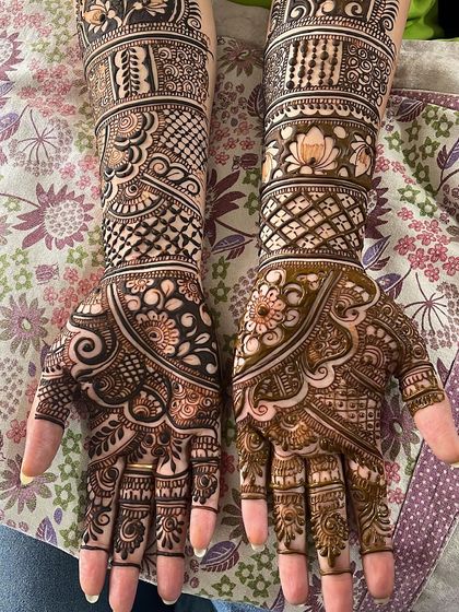 This image shows the beauty of a well-executed bridal design. The patterns are different on each hand but are thematically connected through the use of similar floral and geometric motifs.