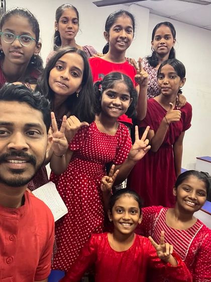 Day 6 of Navratri 2024 was Red. Here's a selfie with students channeling passion and power in their vibrant outfits.