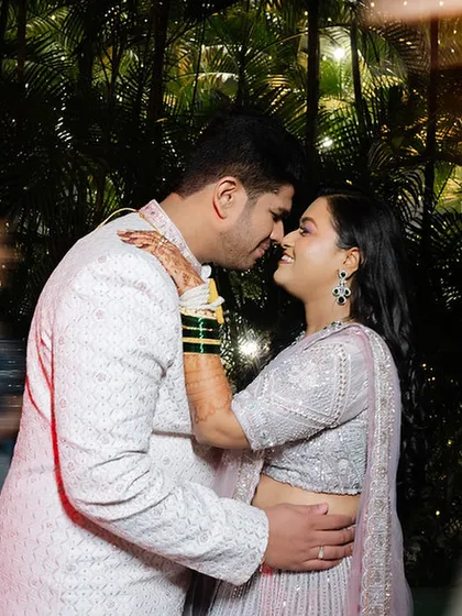 A close, romantic portrait of the couple, their faces close together, sharing a special moment.