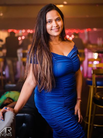 A guest posing at the bar.