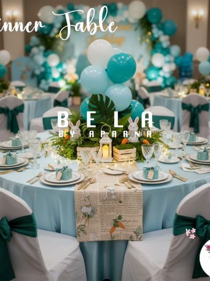 A guest dinner table continuing the Rabbit Land theme. The light blue tablecloth, green chair sashes, and custom-printed table runner with rabbit illustrations ensure the theme is carried throughout the entire venue.