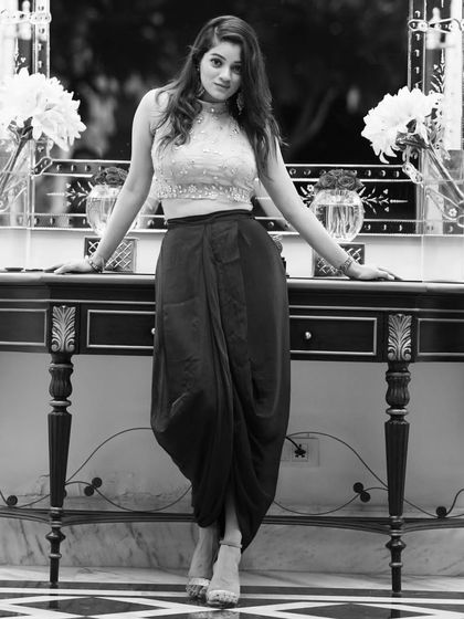A stylish black and white shot in an Indo-western outfit. This look is perfect for sangeets, cocktail parties, or corporate events.