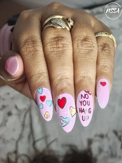 Fun and playful conversation heart nails, perfect for Valentine's Day. Our students learn to create trendy and seasonal designs.