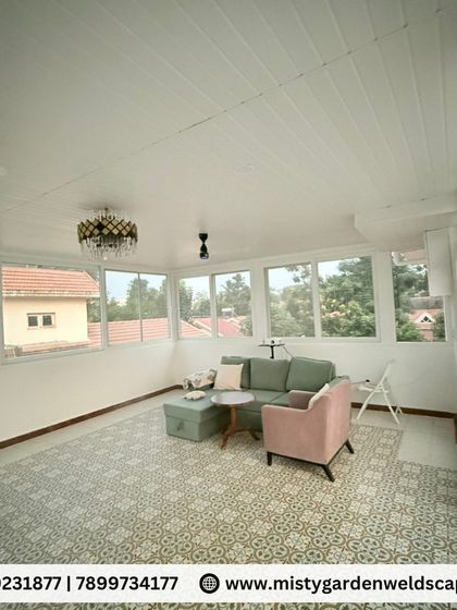 Imagine a bright, airy living room on your terrace. This is the interior of a fully enclosed gazebo, complete with a PVC ceiling, large UPVC windows, and stylish flooring. It's a perfect example of adding a functional and beautiful room to your home.