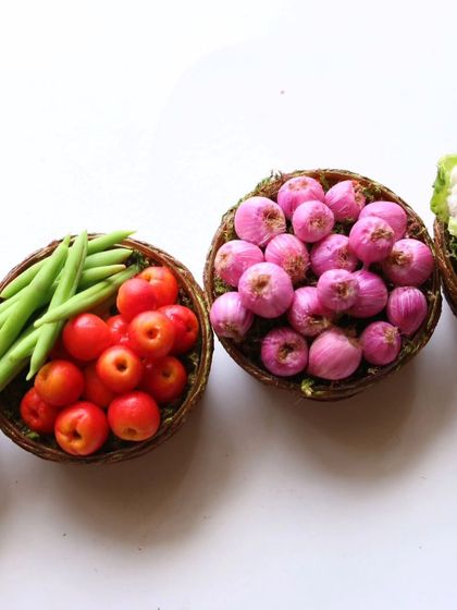 A row of my miniature vegetable baskets, showing the variety of produce.