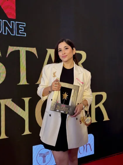 Holding the DCN Star Influencer award. Moments like these are a wonderful reminder that I chose the right path, one that allows me to help people feel beautiful and confident every single day.