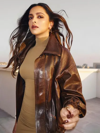 A closer look at Deepika Padukone's dynamic hairstyle. The wind-swept effect adds drama and showcases the healthy texture and layers in her hair.