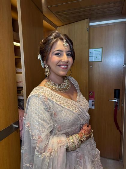 This smiling portrait shows how a subtle approach can still have a major impact. Her skin looks flawless, and her features are beautifully enhanced.