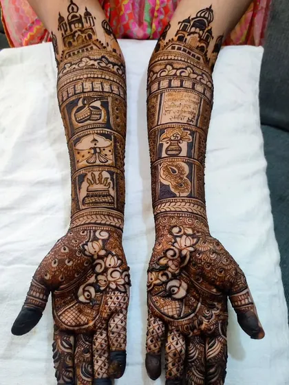 A detailed shot showing the intricate work within each panel, from the architecture to the couple's initials.